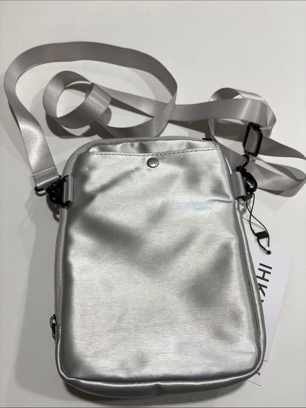 Ikwhip Metallic Matte Silver Everyday Crossbody Bag. Lots of pockets! Web strap